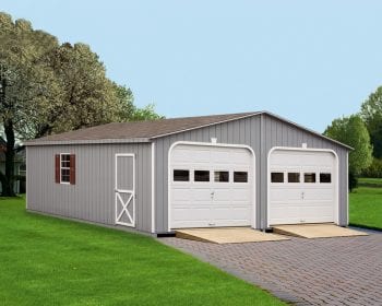 Gray double-wide garage with white doors and a brown roof.