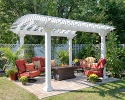 Arcadian white vinyl pergola on a backyard patio.