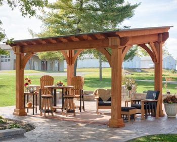 Pine Santa Fe style pergola on a stone patio.