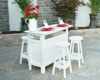 White outdoor bar with white bar stools on a patio.