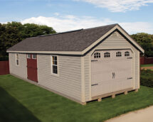 Lantz Deluxe Vinyl Cape Cod Garage with sandstone siding and red double doors.