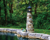 LH 8' stone lighthouse black trim lifestyle image.
