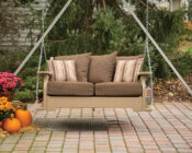 Windy Valley Van Buren Swing with brown cushions lifestyle.